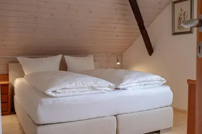 Ein Bett oder Betten in einem Zimmer der Unterkunft Apartmenthaus Brunnenhof