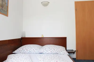 Ein Bett oder Betten in einem Zimmer der Unterkunft Pension Pieschen Dresden