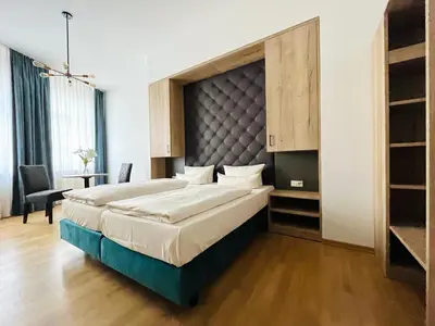 Ein Bett oder Betten in einem Zimmer der Unterkunft Aparthotel Altes Dresden