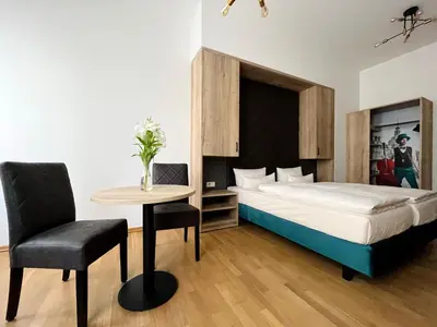 Ein Bett oder Betten in einem Zimmer der Unterkunft Aparthotel Altes Dresden