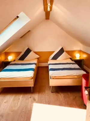 Ein Bett oder Betten in einem Zimmer der Unterkunft Ferienwohnungen 