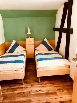 Ein Bett oder Betten in einem Zimmer der Unterkunft Ferienwohnungen 