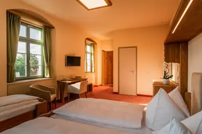 Ein Bett oder Betten in einem Zimmer der Unterkunft Hotel Freyhof