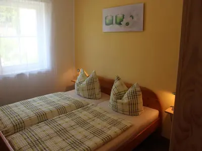 Ein Bett oder Betten in einem Zimmer der Unterkunft chicke Ferienwohnung in Struppen