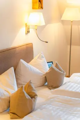 Ein Bett oder Betten in einem Zimmer der Unterkunft Pirnscher Hof - Hotel Garni