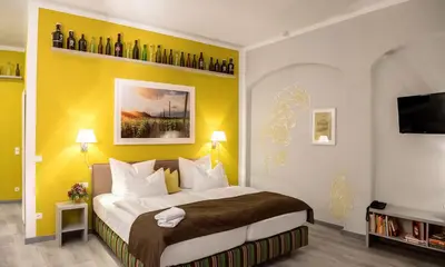 Ein Bett oder Betten in einem Zimmer der Unterkunft Pirnscher Hof - Hotel Garni