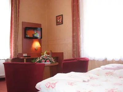 Ein Bett oder Betten in einem Zimmer der Unterkunft Pension Villa Anna