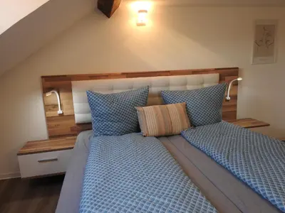 Ein Bett oder Betten in einem Zimmer der Unterkunft Ferienwohnungen am Hauptplatz
