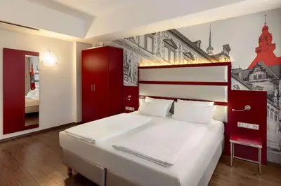 Ein Bett oder Betten in einem Zimmer der Unterkunft Amedia Plaza Dresden, Trademark Collection by Wyndham