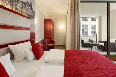 Ein Bett oder Betten in einem Zimmer der Unterkunft Amedia Plaza Dresden, Trademark Collection by Wyndham