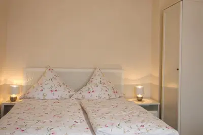Ein Bett oder Betten in einem Zimmer der Unterkunft Ferienwohnung Zum Lilienstein