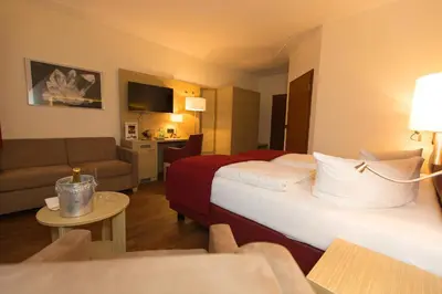 Ein Bett oder Betten in einem Zimmer der Unterkunft Hotel Kreller