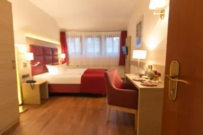 Ein Bett oder Betten in einem Zimmer der Unterkunft Hotel Kreller