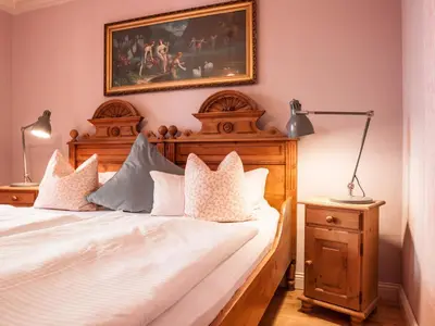 Ein Bett oder Betten in einem Zimmer der Unterkunft Das Forsthaus Hotelapartments