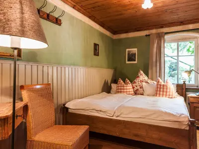 Ein Bett oder Betten in einem Zimmer der Unterkunft Das Forsthaus Hotelapartments