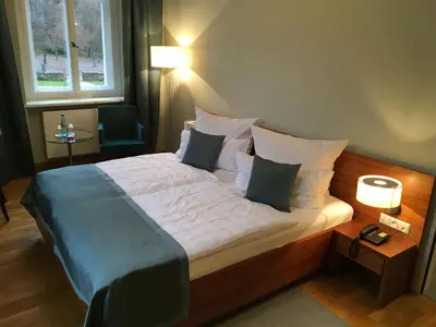 Ein Bett oder Betten in einem Zimmer der Unterkunft Hotel Schloss Rabenstein