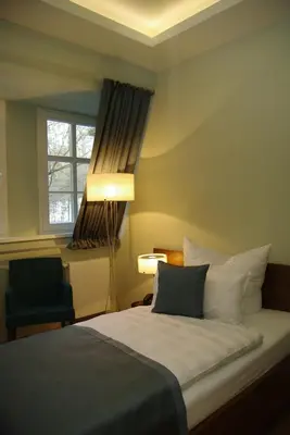 Ein Bett oder Betten in einem Zimmer der Unterkunft Hotel Schloss Rabenstein