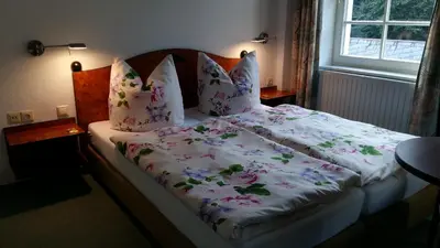 Ein Bett oder Betten in einem Zimmer der Unterkunft Pension am Tharandter Wald
