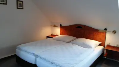Ein Bett oder Betten in einem Zimmer der Unterkunft Pension am Tharandter Wald