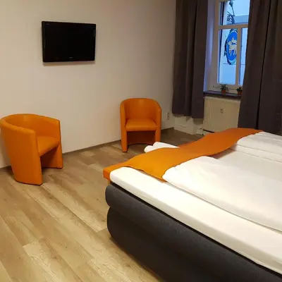 Ein Bett oder Betten in einem Zimmer der Unterkunft Ferienwohnung 1 Christiansdorf Freiberg