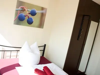 Ein Bett oder Betten in einem Zimmer der Unterkunft Weingut Jan Ulrich
