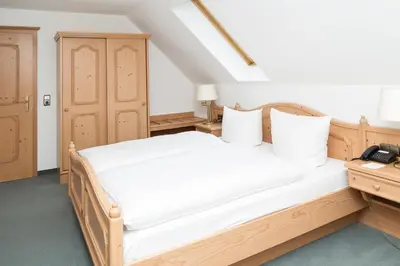 Ein Bett oder Betten in einem Zimmer der Unterkunft Landhotel Sonnenhof
