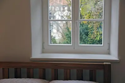 Ein Bett oder Betten in einem Zimmer der Unterkunft Stadtvilla Rosengasse 7