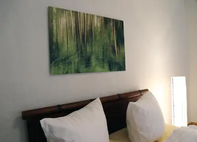 Ein Bett oder Betten in einem Zimmer der Unterkunft Stadtvilla Rosengasse 7