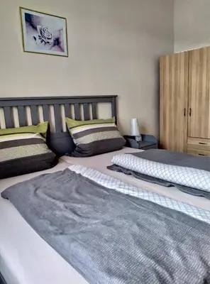Ein Bett oder Betten in einem Zimmer der Unterkunft Ambiente an der Elbe, Wohnung OG