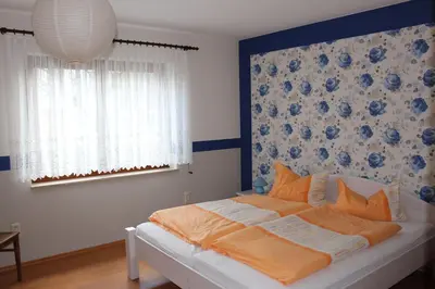 Ein Bett oder Betten in einem Zimmer der Unterkunft Ferienwohnung Illgen