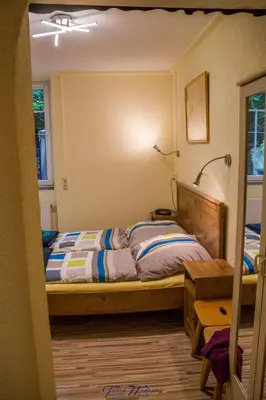 Ein Bett oder Betten in einem Zimmer der Unterkunft Ferienwohnung Franziska Wünsche, Wohnung 1