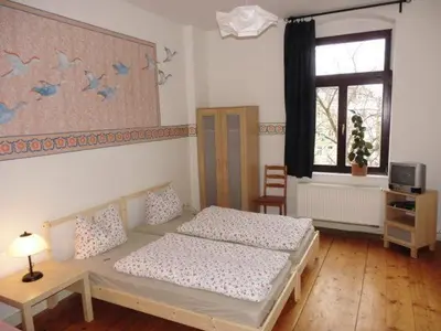 Ein Bett oder Betten in einem Zimmer der Unterkunft 3R Fewo bis 9 Personen zentral T4