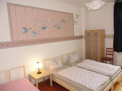 Ein Bett oder Betten in einem Zimmer der Unterkunft 3R Fewo bis 9 Personen zentral T4