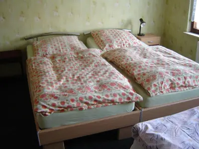 Ein Bett oder Betten in einem Zimmer der Unterkunft Zimmervermietung Heide Fiege