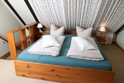 Ein Bett oder Betten in einem Zimmer der Unterkunft Altsächsischer Gasthof Kleines Vorwerk