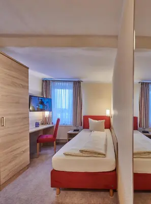 Ein Bett oder Betten in einem Zimmer der Unterkunft Hotel Elbparadies