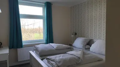 Ein Bett oder Betten in einem Zimmer der Unterkunft Herrenhaus Schmölen GbR