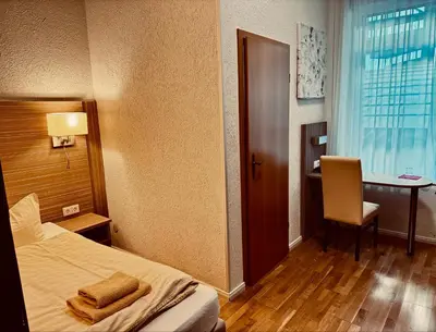 Ein Bett oder Betten in einem Zimmer der Unterkunft Hotel Goldener Anker