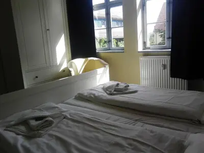 Ein Bett oder Betten in einem Zimmer der Unterkunft Alte Apotheke