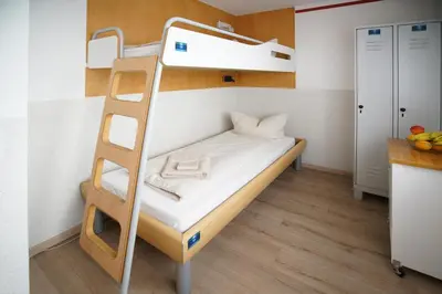 Ein Bett oder Betten in einem Zimmer der Unterkunft Hostel Senftenberg