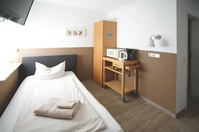 Ein Bett oder Betten in einem Zimmer der Unterkunft Hostel Senftenberg