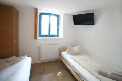 Ein Bett oder Betten in einem Zimmer der Unterkunft Hostel Senftenberg