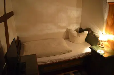 Ein Bett oder Betten in einem Zimmer der Unterkunft zum Frongut