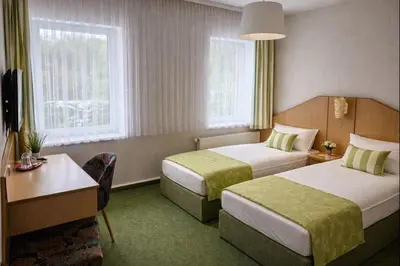 Ein Bett oder Betten in einem Zimmer der Unterkunft Richzenhainer-Hof