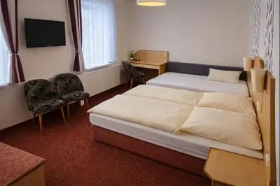 Ein Bett oder Betten in einem Zimmer der Unterkunft Richzenhainer-Hof