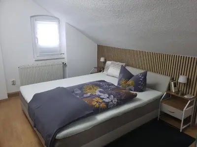Ein Bett oder Betten in einem Zimmer der Unterkunft Ferienapartements Girrbach