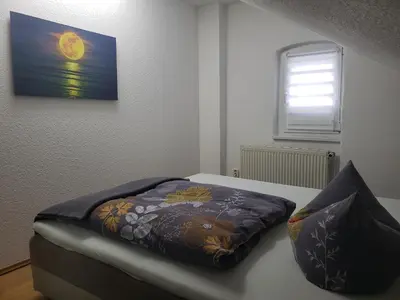 Ein Bett oder Betten in einem Zimmer der Unterkunft Ferienapartements Girrbach