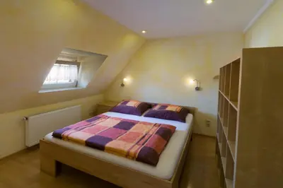 Ein Bett oder Betten in einem Zimmer der Unterkunft Ferienwohnung Löffler