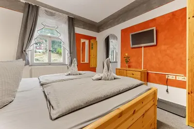 Ein Bett oder Betten in einem Zimmer der Unterkunft Pension Schrammsteinbaude
