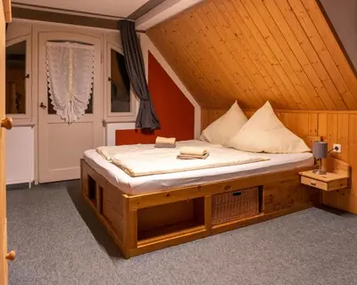 Ein Bett oder Betten in einem Zimmer der Unterkunft Pension Schrammsteinbaude